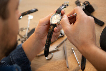 a watchmaker or repair man in action