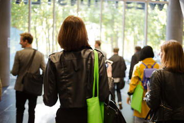 People leaving conference hall