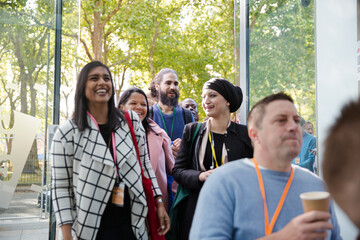 People arriving at conference