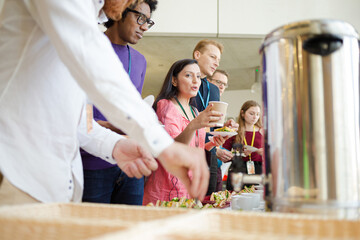 People drinking coffee during conference break
