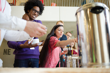 People drinking coffee during conference break
