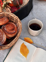 Autumn rustic still life: fruits, vegetables and cup of tea: pumpkin, pears, apple, melon, grape and corn. Thanksgiving Day concept with place for text. Autumn aesthetic coziness, top view. 