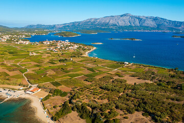 Aerial view of the beaches and fields near Lumbarda town on Korcula Island, Adriatic Sea in Croatia