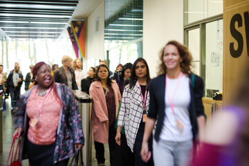 People entering conference hall