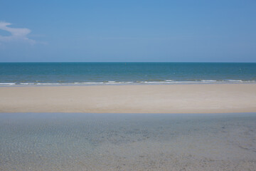 Fototapeta na wymiar blue sky on the beach and sea sand.