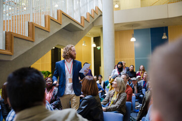 Audience watching male speaker