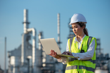 Engineer inspecting in industrial oil refinery. Industry 4.0 concept. Background blurred concept.