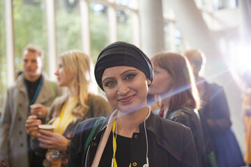 Smiling businesswoman in conference hall