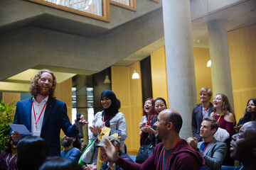 Speaker with microphone talking to audience