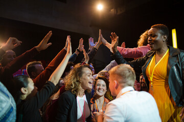 Audience reaching for and talking with speakers