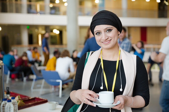 Smiling woman in hijab during conference break