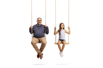 Happy grandfather and granddaughter playing on swings
