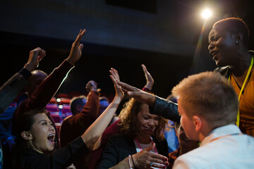 Audience reaching for and talking with speakers