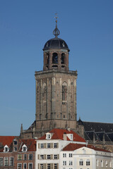 Fototapeta na wymiar The tower of the Great Church and houses in the city of Deventer, the Netherlands