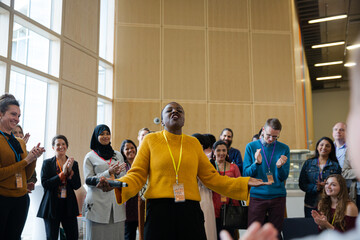 Female speaker with microphone talking to audience