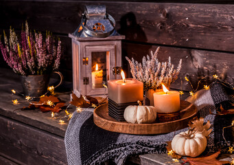Beautiful autumn terracce decoration with pumpkins, lantern, plants and flowers