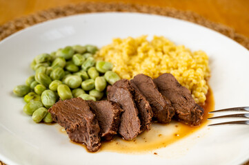 Sliced lean deer meat, boiled broad bean , semolina pasta 