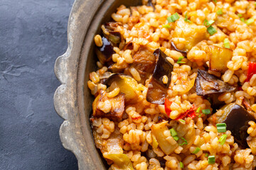 Traditional delicious Turkish food; Bulgur pilaf with eggplant and vegetables. (Turkish name; Patlicanli bulgur pilavi)