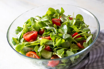 Purslane salad with cheese balls and olives inside. Healthy diet salad.