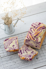 fresh baked purple sweet potato bread loaf on rack