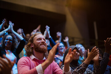 Enthusiastic audience clapping and cheering
