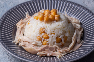 Traditional delicious Turkish food; Rice with chickpeas and chicken (Turkish name; Tavuklu nohutlu pilav or pilaf)