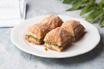 Traditional turkish new dessert cold milky baklava with pistachio (Turkish name; soguk baklava)