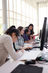 Students using computer in library