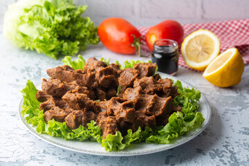 Traditional delicious Turkish food; Turkish name; Cig kofte (raw meatball in Turkish) with lettuce