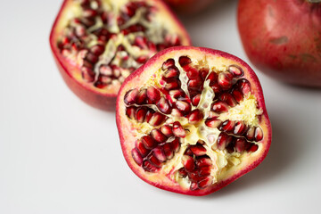 Pomegranate On White Background Close Up Cut In Half