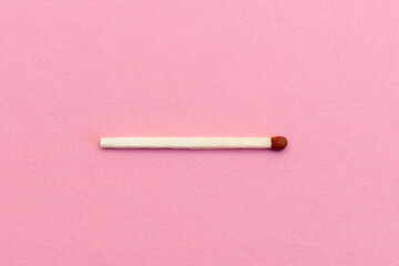 Closeup match on a pink background with clipping path.matchstick flat lay,copy space,selective focus.