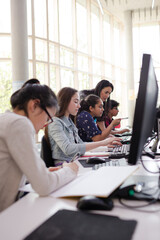 Students using computer in library