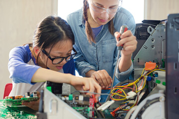 Girl students assembling computer in classroom © KOTO