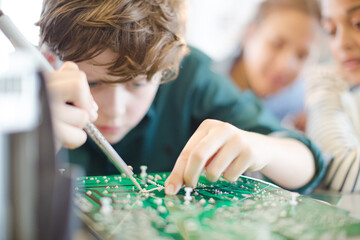 Students assembling model in classroom