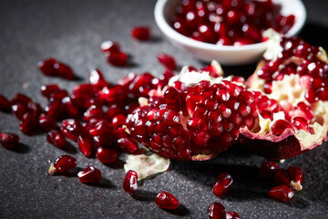 Fresh pomegranate seeds on marble