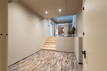 Interior of a hotel corridor with stairs