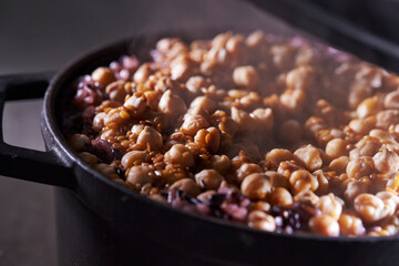 Chickpeas and mixed grain rice in a stone pot