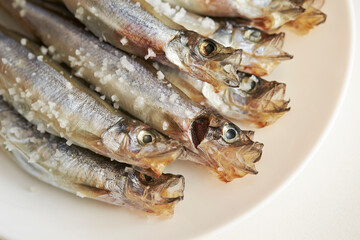 Salted small saltwater fish on a Plate