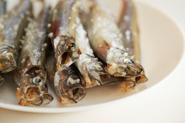 Salted small saltwater fish on a Plate