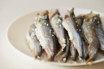 Salted small saltwater fish on a Plate