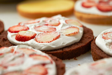 Making fresh cream strawberry cake
