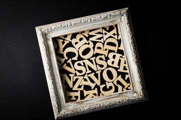 The word 'sns' between wooden letters