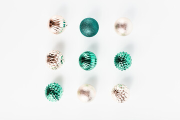 beautiful geometric composition of Christmas decorations. balls of gold and turquoise color. flat lay, top view