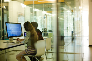 Students using computer at desk