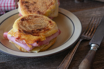 English muffin with ham and cheese