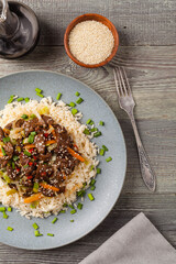 Traditional Korean Bulgogi dish.  Thinly cut, grilled beef, served with rice and vegetables.