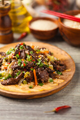 Traditional Korean Bulgogi dish.  Thinly cut, grilled beef, served with rice and vegetables.