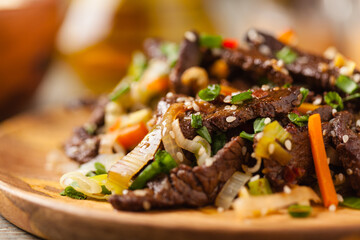Traditional Korean Bulgogi dish.  Thinly cut, grilled beef, served with rice and vegetables.