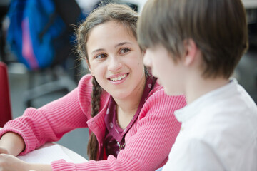 Students using digital tablet in library