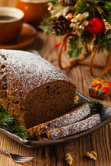 Homemade gingerbread cake. Christmas decoration. Front view. Natural wooden background.